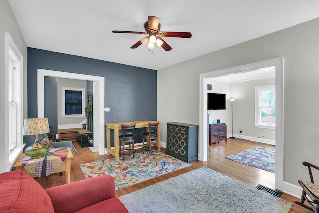 708 W Church St, Champaign, IL 61820 - living area with a ceiling fan and wood finished floors