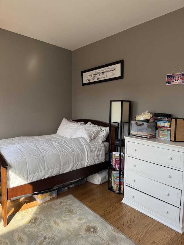 bedroom featuring wood finished floors