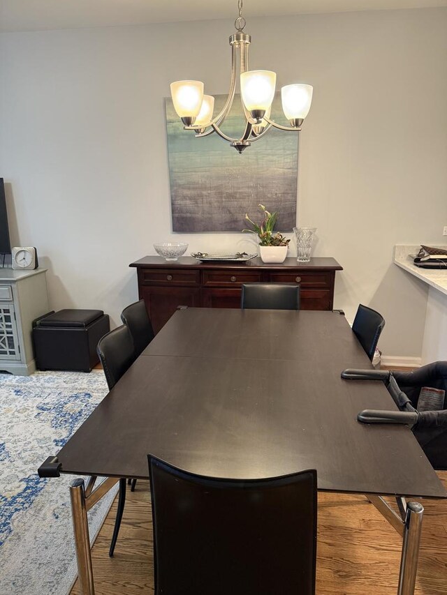 1542 W School St Unit G, Chicago, IL 60657 - dining area featuring a chandelier and wood finished floors