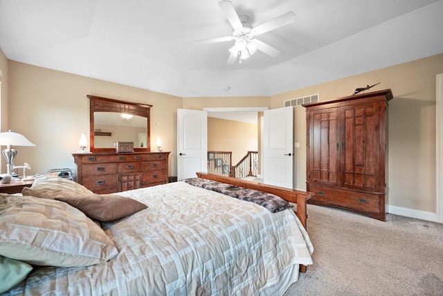 bedroom featuring light colored carpet, baseboards, a ceiling fan, and visible vents