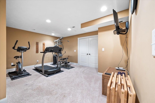 exercise room featuring recessed lighting, baseboards, and carpet floors