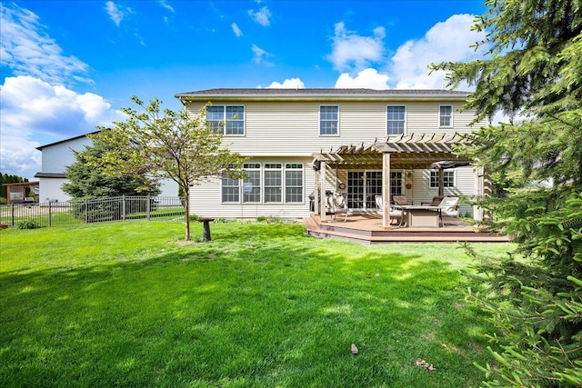 back of house with a pergola, fence, a yard, and a deck