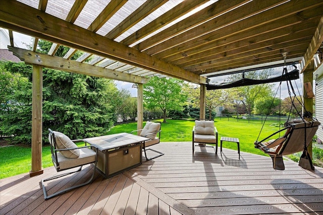 deck with a lawn and fence