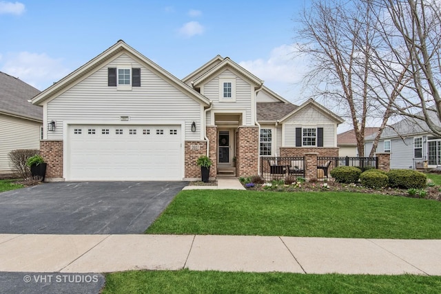 3607 Greystone Ave, Naperville, IL 60564 - view of front of property featuring brick siding, a front yard, a garage, and driveway