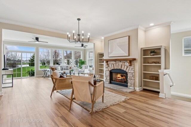 3607 Greystone Ave, Naperville, IL 60564 - living room featuring a wealth of natural light, a notable chandelier, light wood-style floors, and a fireplace