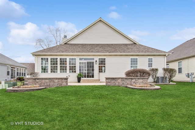 3607 Greystone Ave, Naperville, IL 60564 - back of house featuring roof with shingles, a chimney, and a lawn