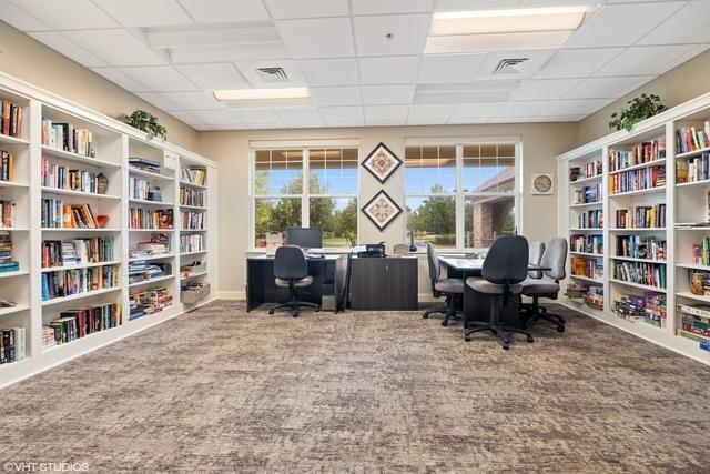 3607 Greystone Ave, Naperville, IL 60564 - carpeted home office with a paneled ceiling, wall of books, and visible vents