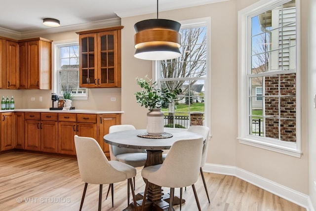 3607 Greystone Ave, Naperville, IL 60564 - dining space featuring crown molding, baseboards, and light wood-type flooring
