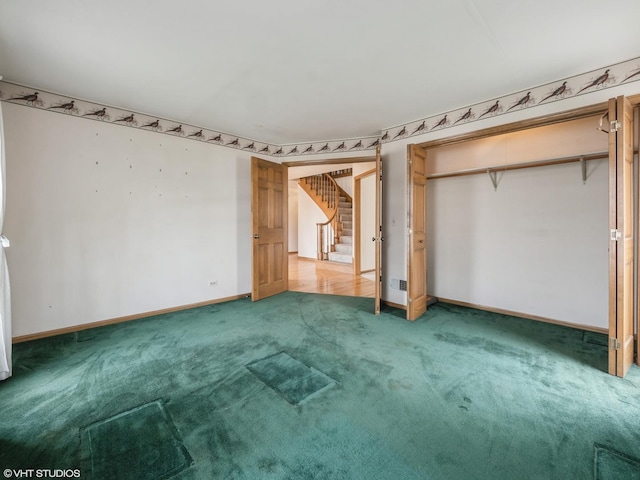 unfurnished bedroom with light carpet, baseboards, and a closet