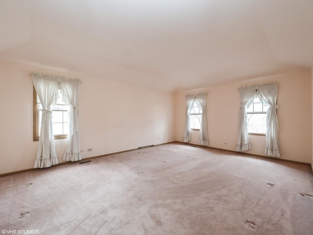 empty room with carpet flooring and baseboards