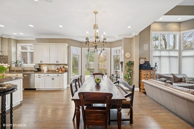 4020 Noble Ct, Northbrook, IL 60062 - dining space featuring plenty of natural light, a chandelier, recessed lighting, wood finished floors, and crown molding