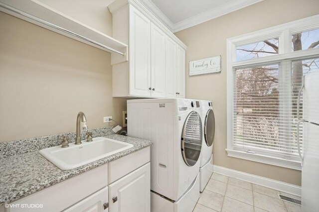 4020 Noble Ct, Northbrook, IL 60062 - laundry room with cabinet space, washer and dryer, ornamental molding, baseboards, and healthy amount of natural light