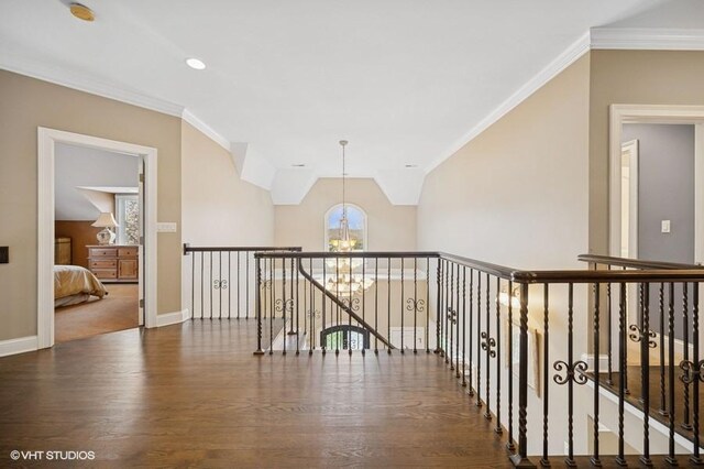 4020 Noble Ct, Northbrook, IL 60062 - hallway featuring a chandelier, wood finished floors, ornamental molding, baseboards, and an upstairs landing