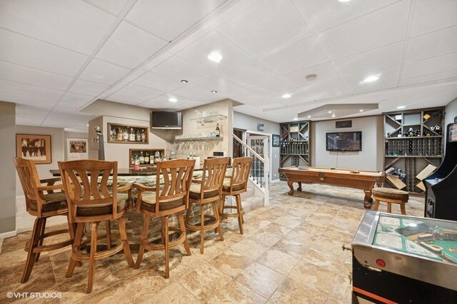 4020 Noble Ct, Northbrook, IL 60062 - dining space with a bar, a paneled ceiling, billiards, stairs, and baseboards