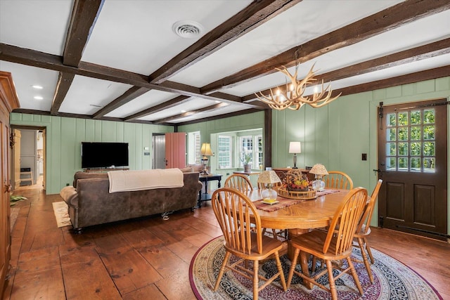 2066 County Road 125 E, Mahomet, IL 61853 - dining area with a healthy amount of sunlight, a notable chandelier, visible vents, and dark wood-style floors