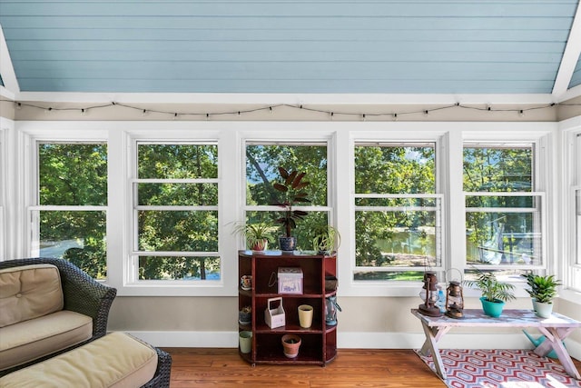 2066 County Road 125 E, Mahomet, IL 61853 - sunroom with baseboards, vaulted ceiling, and wood finished floors