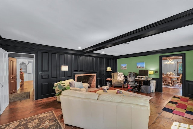 2066 County Road 125 E, Mahomet, IL 61853 - living room featuring a decorative wall, ornamental molding, wood finished floors, a brick fireplace, and beam ceiling