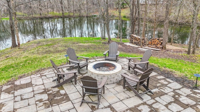 2066 County Road 125 E, Mahomet, IL 61853 - view of patio / terrace with a fire pit and a water view