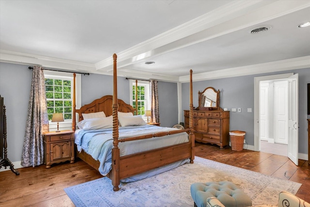2066 County Road 125 E, Mahomet, IL 61853 - bedroom featuring crown molding, visible vents, baseboards, and light wood-type flooring