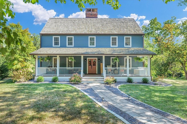 2066 County Road 125 E, Mahomet, IL 61853 - view of front of property with a front lawn, covered porch, and a chimney