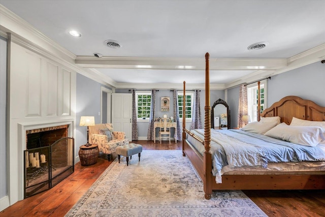 2066 County Road 125 E, Mahomet, IL 61853 - bedroom with wood-type flooring, ornamental molding, and visible vents