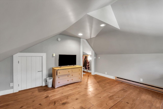 2066 County Road 125 E, Mahomet, IL 61853 - bonus room with light wood-style flooring, a baseboard radiator, baseboards, and lofted ceiling