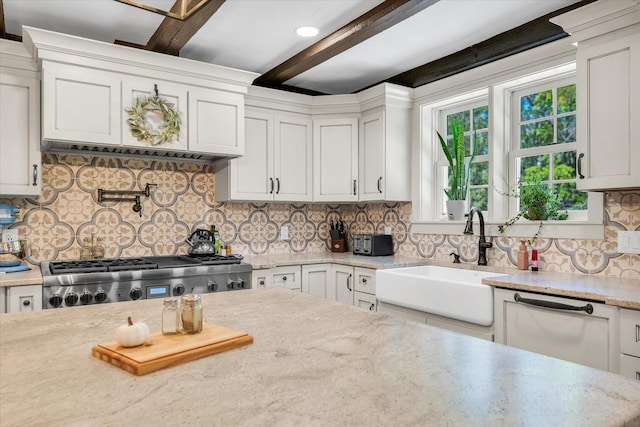 2066 County Road 125 E, Mahomet, IL 61853 - kitchen with tasteful backsplash, dishwasher, beamed ceiling, stove, and a sink