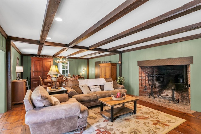 2066 County Road 125 E, Mahomet, IL 61853 - living room with a chandelier, light wood-style floors, beam ceiling, and a brick fireplace