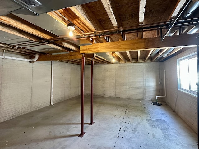 basement with brick wall