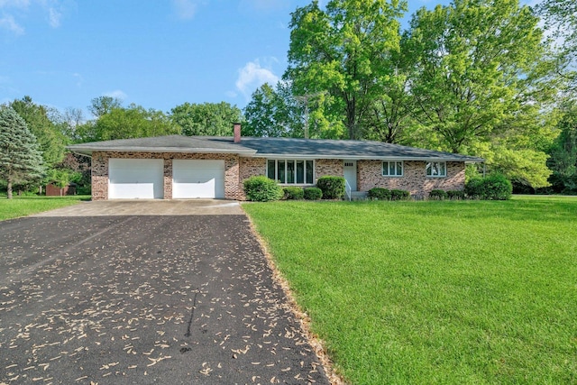 5815 E S Prairie Dr, Morris, IL 60450 - ranch-style home with driveway, a front yard, a garage, and brick siding