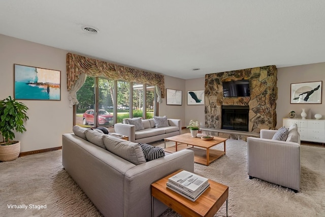 5815 E S Prairie Dr, Morris, IL 60450 - carpeted living room with a stone fireplace and baseboards