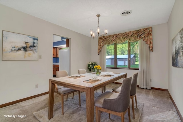 5815 E S Prairie Dr, Morris, IL 60450 - dining space with light carpet, a chandelier, and baseboards