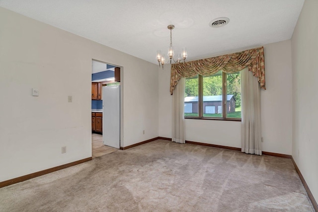 5815 E S Prairie Dr, Morris, IL 60450 - empty room featuring light carpet, a chandelier, and baseboards