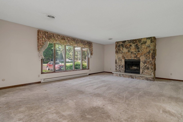 5815 E S Prairie Dr, Morris, IL 60450 - unfurnished living room with baseboard heating, carpet, baseboards, and a stone fireplace