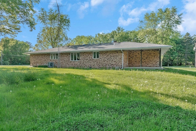 5815 E S Prairie Dr, Morris, IL 60450 - rear view of house with brick siding and central AC unit