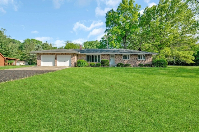 5815 E S Prairie Dr, Morris, IL 60450 - ranch-style home with dirt driveway, a front yard, brick siding, and a garage