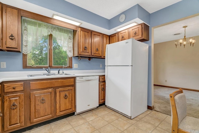 5815 E S Prairie Dr, Morris, IL 60450 - kitchen with white appliances, a sink, brown cabinets, and light countertops