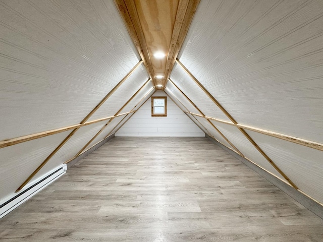 interior space featuring a baseboard radiator, wood finished floors, vaulted ceiling, and wood ceiling