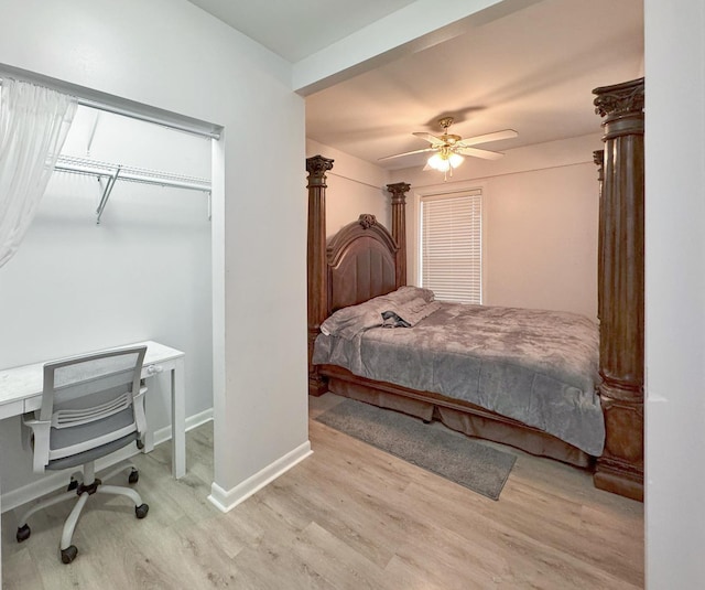 bedroom with wood finished floors, ceiling fan, and baseboards