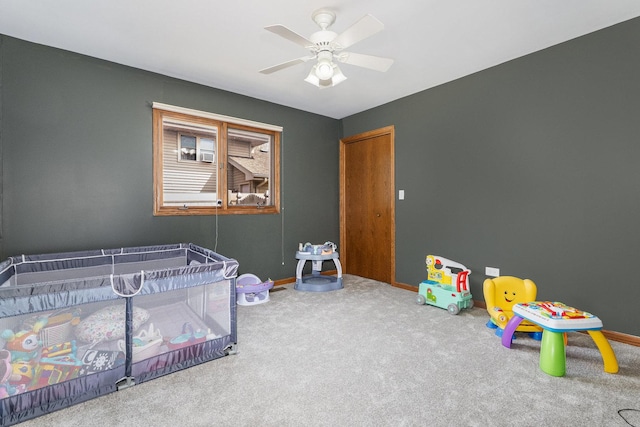 bedroom with baseboards, ceiling fan, and carpet flooring