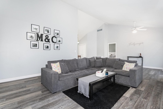 living area with visible vents, wood finished floors, baseboards, ceiling fan, and high vaulted ceiling