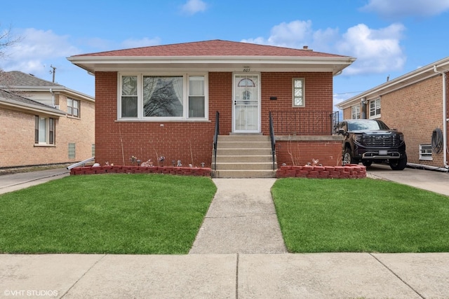 605 Saginaw Ave, Calumet City, IL 60409 - bungalow with brick siding and a front yard