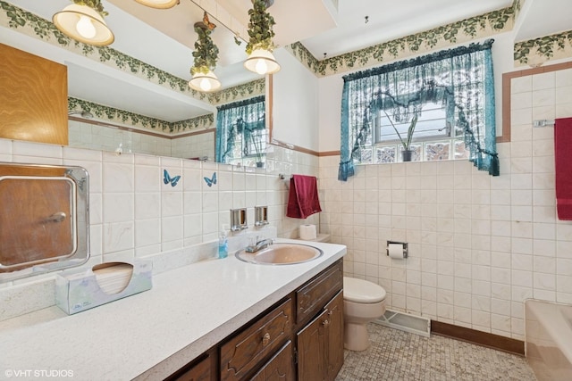 605 Saginaw Ave, Calumet City, IL 60409 - full bathroom featuring vanity, tile walls, toilet, a tub to relax in, and walk in shower