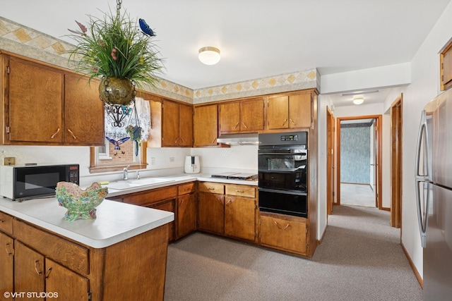 605 Saginaw Ave, Calumet City, IL 60409 - kitchen featuring a warming drawer, a sink, freestanding refrigerator, black microwave, and brown cabinets