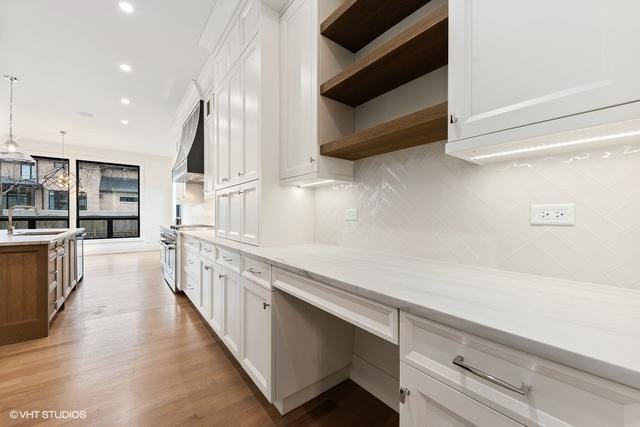 260 E Grantley Ave, Elmhurst, IL 60126 - kitchen featuring stainless steel gas range, wall chimney range hood, white cabinets, and open shelves