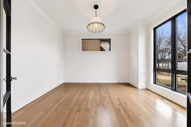 260 E Grantley Ave, Elmhurst, IL 60126 - empty room with baseboards, light wood-style floors, and crown molding
