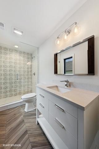 260 E Grantley Ave, Elmhurst, IL 60126 - bathroom featuring a shower stall, visible vents, toilet, and vanity