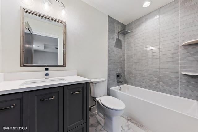 260 E Grantley Ave, Elmhurst, IL 60126 - full bathroom with marble finish floor, shower / bath combination, toilet, and vanity