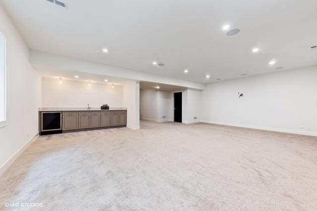 260 E Grantley Ave, Elmhurst, IL 60126 - unfurnished living room with bar area, recessed lighting, baseboards, visible vents, and light carpet