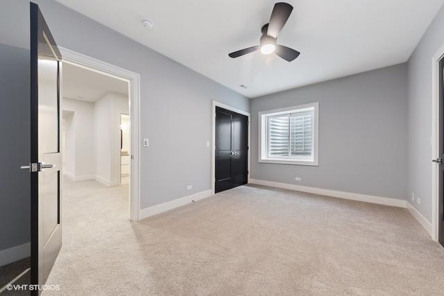 260 E Grantley Ave, Elmhurst, IL 60126 - unfurnished bedroom with light carpet, baseboards, a closet, and ceiling fan